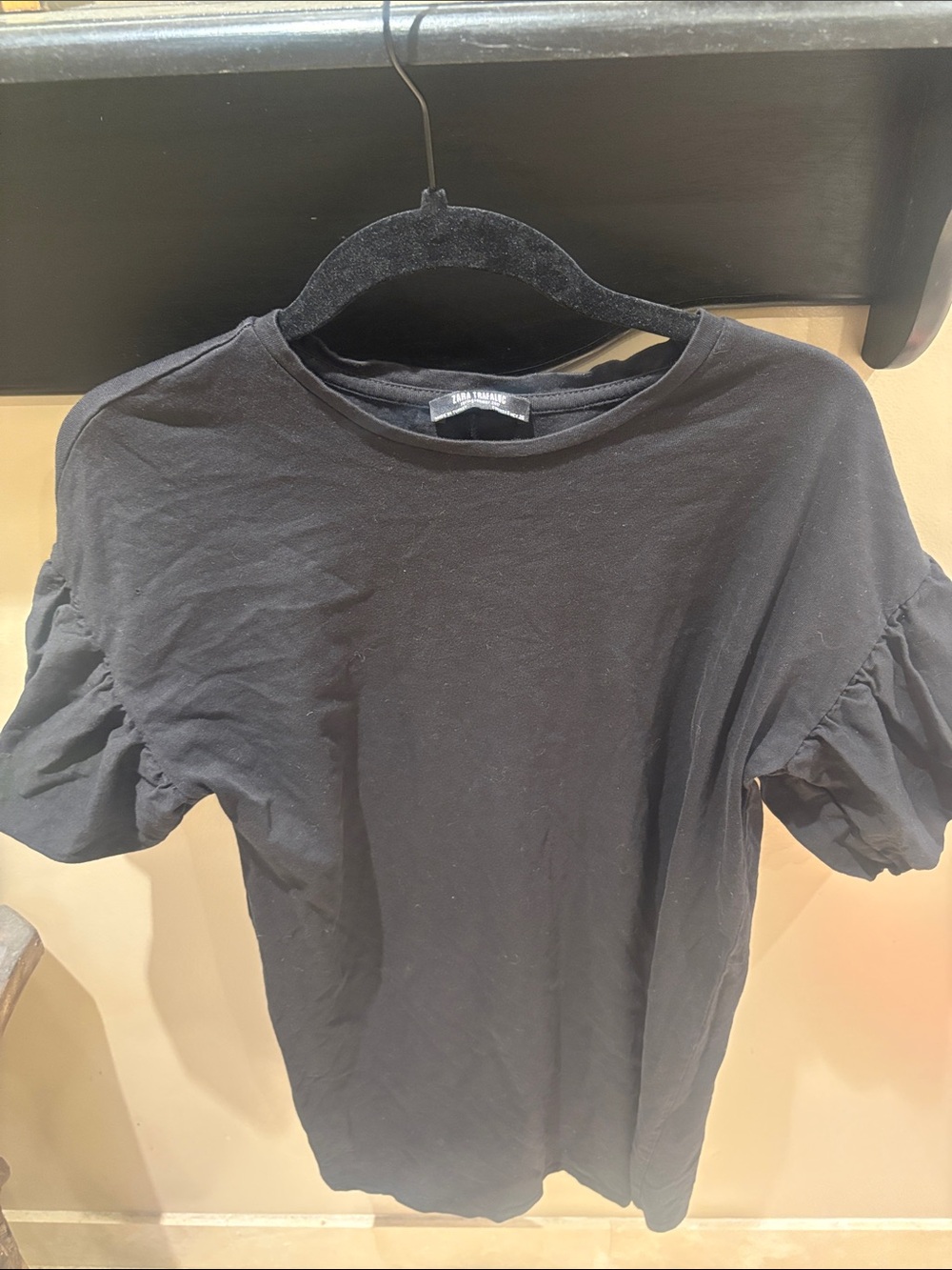 Woman’s black Zara Puff-Sleeve dress